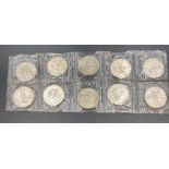 A set of ten Mexico 1968 Olympics commemorative coins in sealed packet.