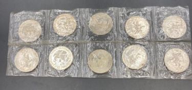 A set of ten Mexico 1968 Olympics commemorative coins in sealed packet.