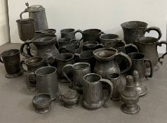 A large selection of pewter to include mugs, tankards and goblets, various ages