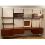 A rare Mid Century teak wall unit (drawers, cabinets, display, drink cabinet) in the style of Paul