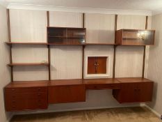 A rare Mid Century teak wall unit (drawers, cabinets, display, drink cabinet) in the style of Paul