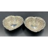 A pair of silver heart shaped pin dishes, hallmarked for London