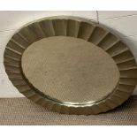 A contemporary round mirror with waved frame (Dia80cm)