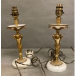 A pair of marble and gilt table lamps