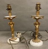 A pair of marble and gilt table lamps