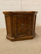 An octagonal single cupboard, flame mahogany side table by Heritage AF