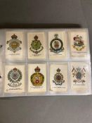 Three albums of cigarette cards and silks to include Phillips Ltd and Wills