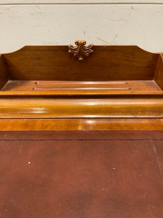 A reproduction correspondence desk with red leather top on claw and ball feet (H90cm W100cm D70cm) - Image 2 of 6