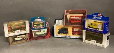A selection of boxed Diecast yans, buses and lorries
