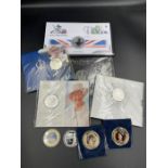 A selection of collector coin packs, predominantly with a British monarchy theme.