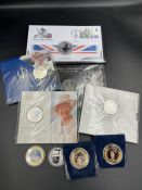 A selection of collector coin packs, predominantly with a British monarchy theme.