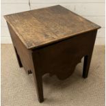 An oak ceramic lined commode
