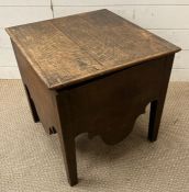 An oak ceramic lined commode