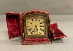 A 1930'a French travel alarm clock in case