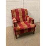 A red and gold upholstered lounge chair