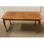 A yew coffee table on cabriole legs with string inlay