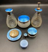 A selection of blue enamel and silver dressing table set items
