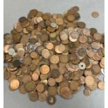 A large collection of coins, including a lot of Great British pennies.