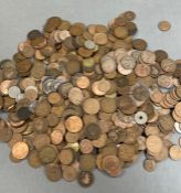 A large collection of coins, including a lot of Great British pennies.