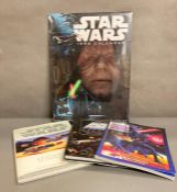 A Star Wars collectors Editions "The Battles" 1998 calendar and three Start Wars collectors books