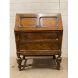 An oak two drawer bureau AF