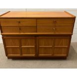 A Mid Century Nathan teak sideboard, four drawers and a panelled cupboard under (H75cm W103cm