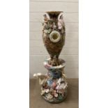 An abstract ceramic sculpture with ornamental barometer face to face from the set of Great