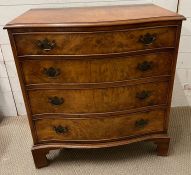 A reproduction George III serpentine chest of drawers raised on bracket feet (H85cm W79cm D50cm)