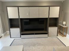 A large media unit with high gloss white doors