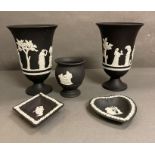A selection of black and white Wedgewood Jasperware to include pin dishes, a pot and two vases