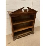 A two shelf inlaid bookcase on bun feet Height 97cm Length 82cm Depth 35cm