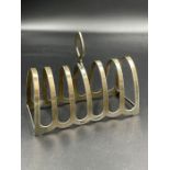 A hallmarked silver toast rack by William Suckling Ltd, Birmingham 1956