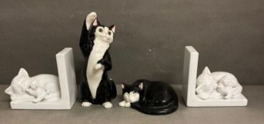 A selection of ceramic cats to include a pair of bookends and a sleeping Staffordshire Just Cats and