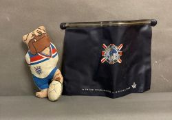 A bulldog bobby world cup mascot and a plastic document case commemoration the 1966 world cup