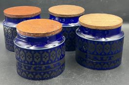 Five vintage storage jars with wooden lids