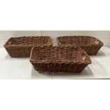 Three wicker rectangular baskets