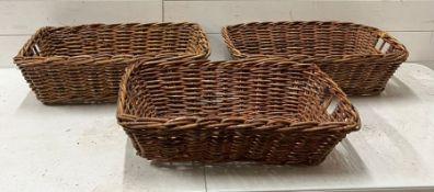 Three wicker rectangular baskets