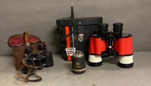 A pair of Champion Racing binoculars and 50th anniversary table lighter and a pair of Lupica field