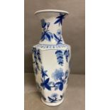 A large blue and white vase with floral motif