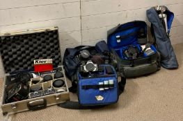 A selection of camera and camera equipment to include various lenses, canon bodies and Kier cameras
