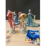 A selection of Walt Disney figurines and four others.