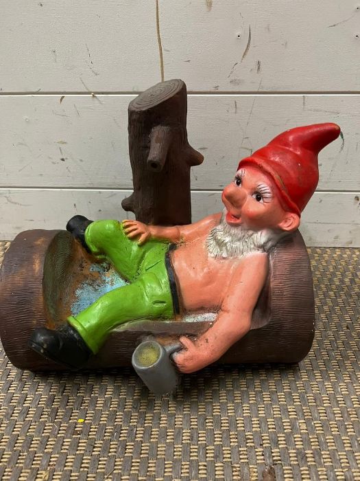 A garden gnome resting on a log after a few beers (H26cm)