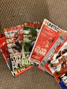 A box containing a large quantity of Manchester United "United Review" magazines
