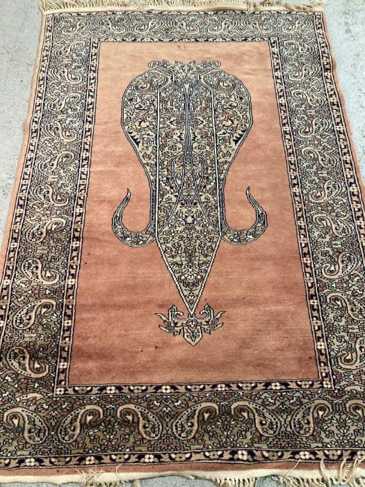 A brown ground wool rug with central medallion and geometric border red and blues (130cm x 210cm) - Image 7 of 12