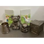 A selection of nursey money boxes, Christening Cups and china book ends