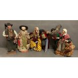 A selection of six French dolls or figures depicting country men and women.