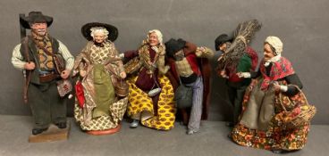 A selection of six French dolls or figures depicting country men and women.