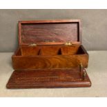 A mahogany box containing a cribbage board and four brass counters AF