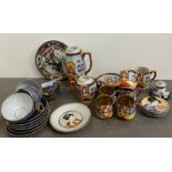 A selection of oriental theme tea sets and plates