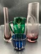 A selection of Mid Century coloured glassware to include vases, jugs and a cup